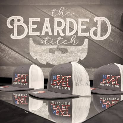Black Next Level inspection caps displayed in a Bearded Stitch photo