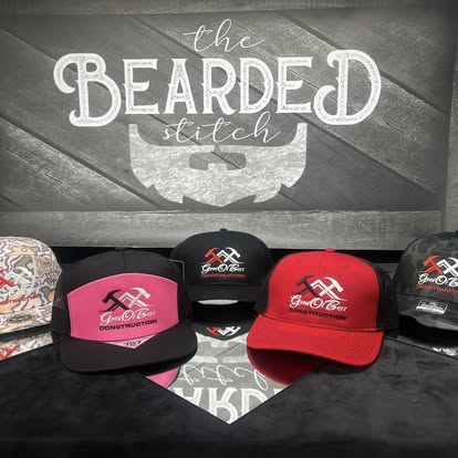 Bright pink and red custom caps displayed together