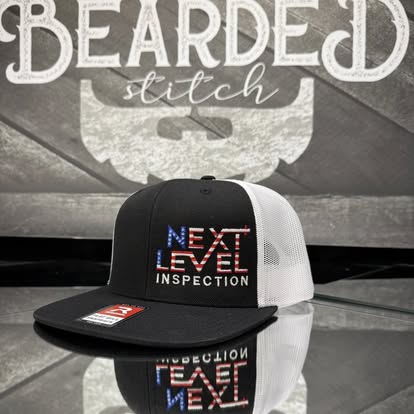 Black custom logo cap displayed in front of a Bearded Stitch backdrop