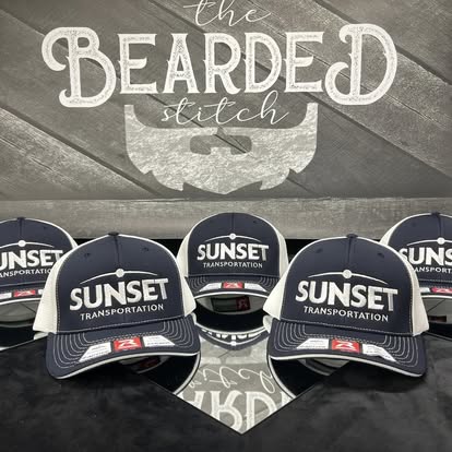 Black Sunset Transportation custom caps displayed together